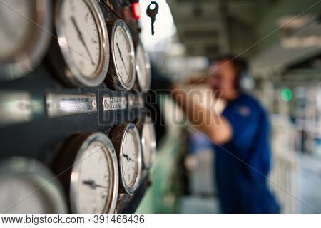 Marine Engineer Officer Controlling Vessel Enginesand Propulsion In Engine Control Room Ecr