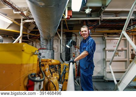 Marine Engineer Officer Controlling Vessel Enginesand Propulsion In Engine Control Room Ecr