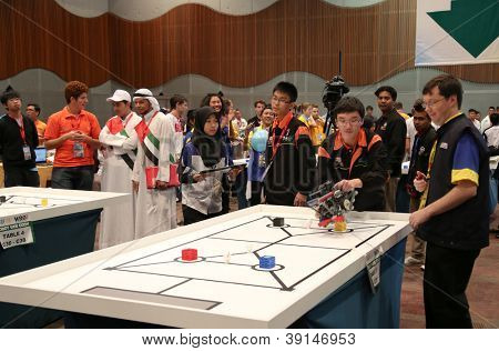 SUBANG JAYA - NOVEMBER 10: Unidentified team members prepare their robot for the competition at the World Robot Olympaid on November 10, 2012 in Subang Jaya, Malaysia.