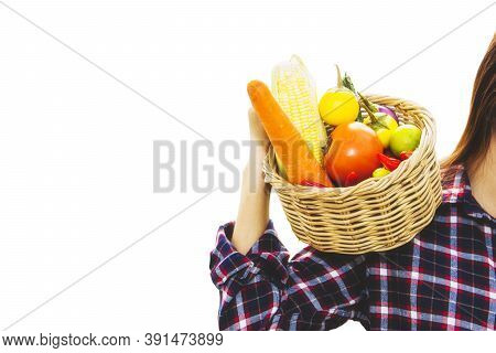 Young Women Gather Useful Fresh Organic Vegetables In A Basket For Consumption And Good Health : Cip
