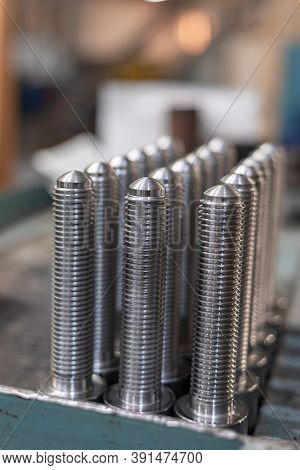 Bolts, Screws And Threaded Rods After Turning On A Rack.