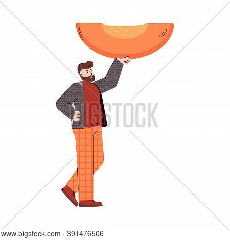 Tiny Cheerful Man Hold A Huge Hunk Of Pumpkin For Cook A Pumpkin Pie. Holiday Traditional Food For T