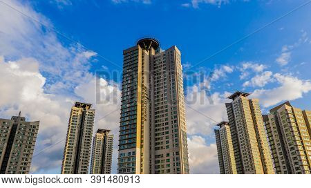 Daejeon, South Korea; September 24,2020: Low Angle View Of Exllutower Apartment Buildings With Blue 