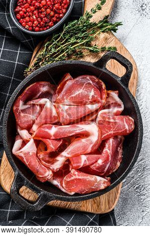 Italian Rolled Bacon Pancetta Piacentina. Pork Meat. White Background. Top View