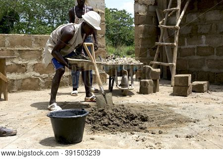 Kabala, Sierra Leone - May 29th 2019: Young African Working In Construction In Africa. Construction 