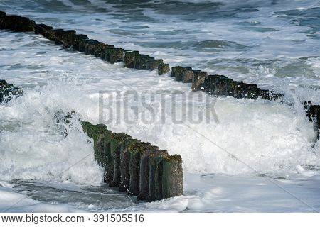 Breaking Waves On Double Row Of Wooden Breakwater At The North Sea Coast At Westkapelle, Zeeland, Th