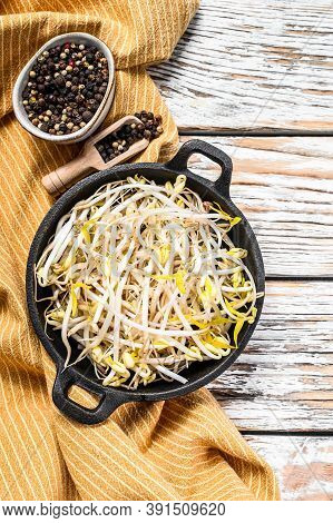 Raw White Organic Bean Sprouts In A Bowl. White Background. Top View