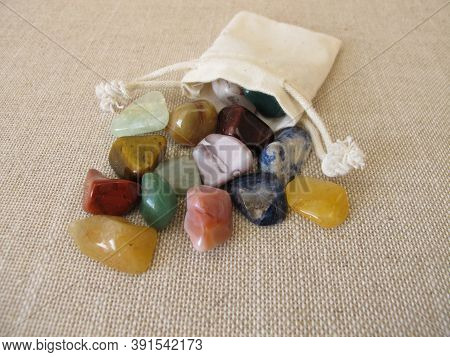 Colorful Tumbled Gemstones In A Small Bag