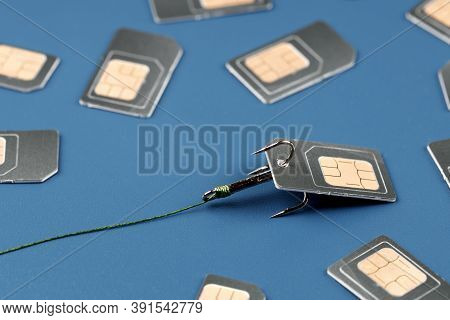 Sim Card On A Fishing Triple Hook Tied To A Thread. Identity Theft Concept