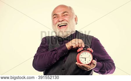 Time And Age Concept. Bearded Man Clock Ticking. Aged Man Holding Alarm Clock. Lifetime Ageing And G