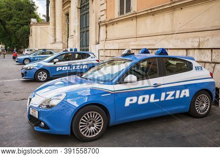 Rome, Italy - May 2, 2020: Italian police cars parked in the city center of Rome. Blue Alfa Romeo cars of Polizia di Stato