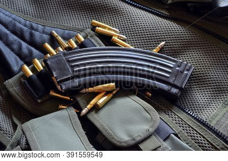 Ammunition 7,62*39.Tactical unloading vest as background. October 23, 2020.Kiev,Ukraine