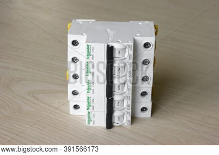 Kharkov, Ukraine - September 22, 2020 : Schneider Electric Circuit Breakers On Light Wood Background