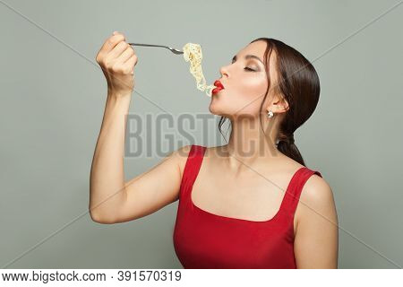 Beautiful Woman Enjoyning Italian Pasta Spaghetti On White Background