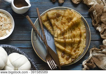 Pumpkin Pancakes With Date Syrup And Almonds