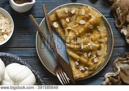 Pumpkin Pancakes With Date Syrup And Almonds