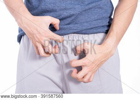 Man Hands Scratching His Crotch Isolated White Background. Medical, Healthcare For Advertising Conce