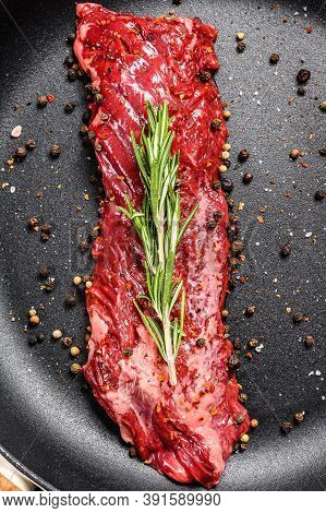 Raw Skirt, Machete Steak In A Pan With Cooking Ingredients. Gray Background. Top View