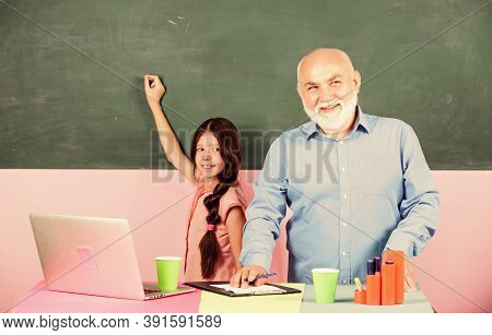 Towards Knowledge. Ature Teacher Help School Girl. Little Girl With Man Tutor Study On Laptop. New T