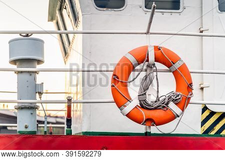 Close Up On Lifebuoys Equipped On Fireboat Or Firefighter Ship. Anchored On Rampart Of Brave Pier In