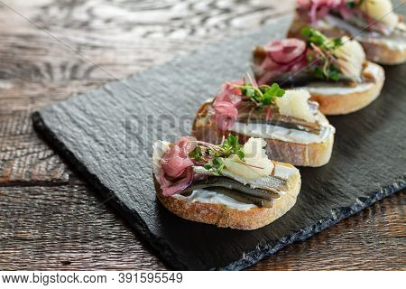 French Fish Tartines On Stone Board. Delicious Restaurant Breakfast Concept