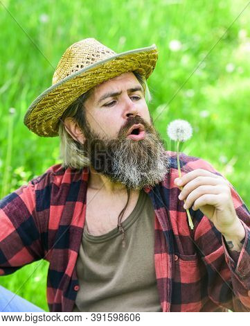 Mental Health. Peaceful Guy Blowing Dandelion. Happy And Carefree Life. Peace Of Mind. Rest And Rela