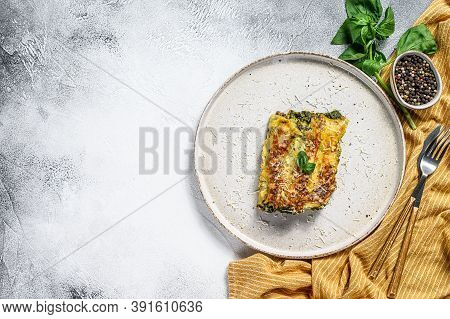Cannelloni With Ricotta And Spinach. Italian Cuisine. Gray Background. Top View. Copy Space