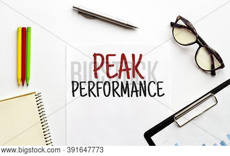 Paper Plate, Glasses, Notepad, Pen And Pencils On The White Background. Business Concept. Text Peak 