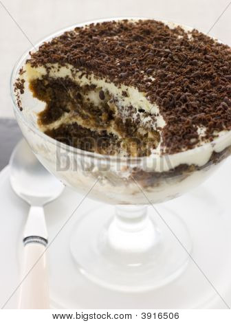 Individual Tiramisu With A Spoon Out