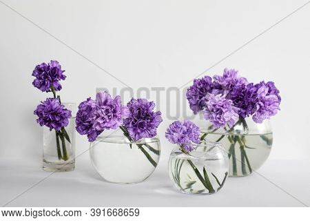 Bridal Bouquets Of Lilac Carnations In A Four Round Glass Vases Different Sizes As Table Decoration