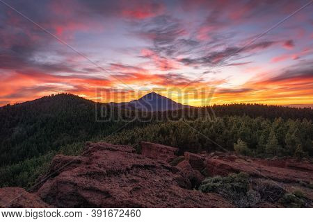 View Of A Volcano In A Sunset And The Sky Full Of Clouds With Beautiful Colors