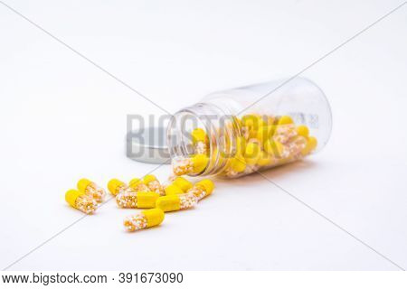 Open Container With Vitamin D3 Capsules Isolated On White Background