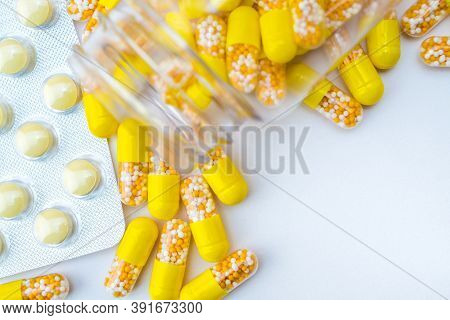 Open Container With Vitamin D3 And K2 Capsules Isolated On White Background