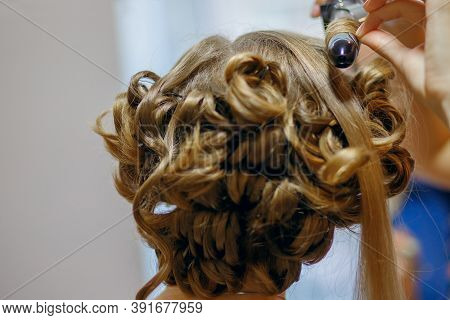 Curlers Make Curls On Women's Hair. Hairdresser Services For The Concept Of Evening And Festive Hair