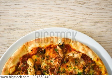 Baked Pizza With Mushrooms, Bacon And Cheese In A White Dish On A Light Wooden Table. Top View. Pizz