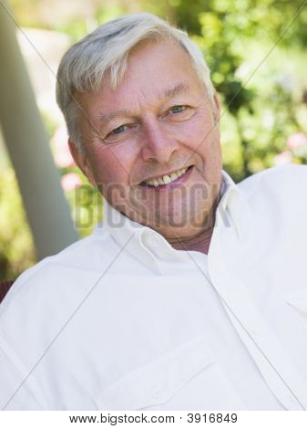 Senior Man Sitting Outdoors