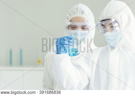 Two Asian Scientist Team Reserch Chemistry Science Tube Experiment Biotech Antibody Sample In Labora