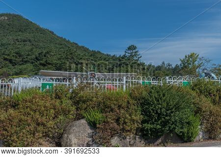 Military Aircraft Parked Behind Fence At Military Theme Park