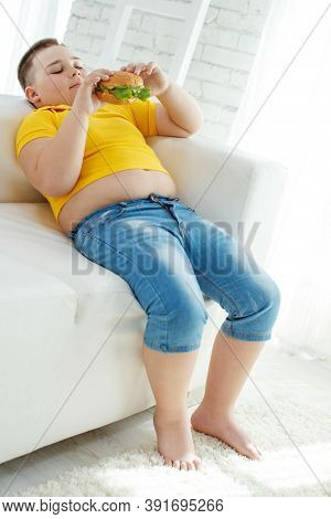A Boy With Metabolic Disorders. Child With The Problem Of Childhood Obesity. Overweight Obese Fat Bo