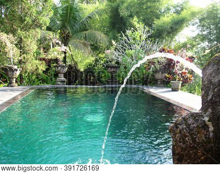 Bali, Indonesia - April 11, 2012: View Of Swimming Pool At Tanah Merah Art Resort Bali, Indonesia - 