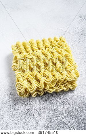 Dry, Raw Quick Cooking Noodle, Instant Noodles. White Background. Top View