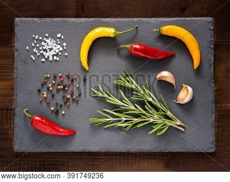 Herbs And On Slate Background. Top View Or Flat Lay. Food Background And Food Ingredients - Rosemary