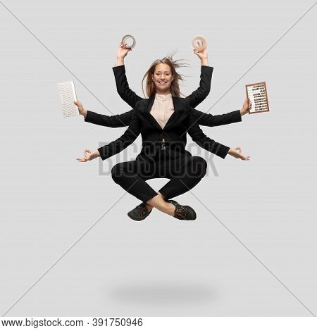 Beautiful Business Woman, Secretary, Multi-armed Manager Levitating Isolated On Grey Studio Backgrou