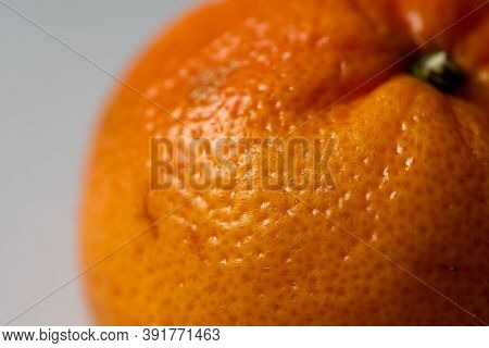 Juicy Orange Or Mandarin Against Plain White Background