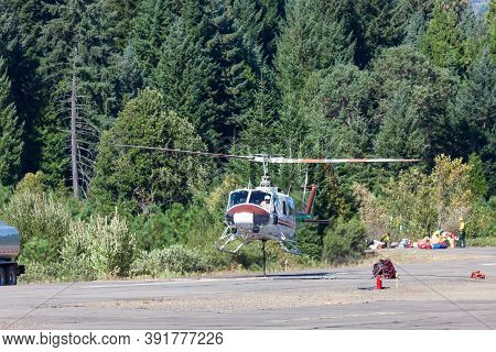 Prospect,  Oregon / Usa - September 9, 2014:  A Fire Fighting Helicopter Takes Off From The Runway W