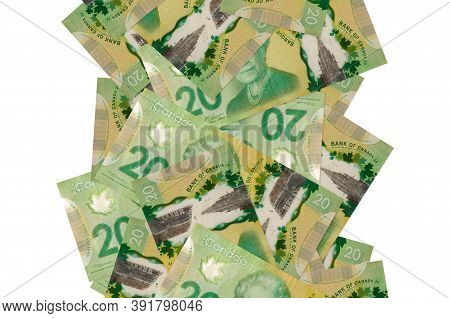 20 Canadian Dollars Bills Flying Down Isolated On White. Many Banknotes Falling With White Copyspace