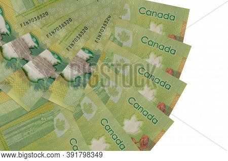 20 Canadian Dollars Bills Lies Isolated On White Background With Copy Space Stacked In Fan Shape Clo