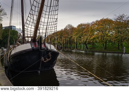Traditional Dutch Boat In The Canal Near The City Gate Zijlpoort