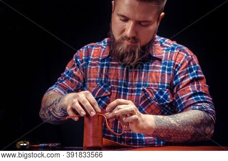 Craftsman Produces Leather Workpiece At The Workplace