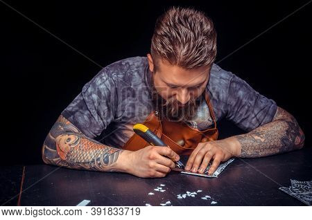 Leather Cutter Creating Leatherwork In His Place Of Work